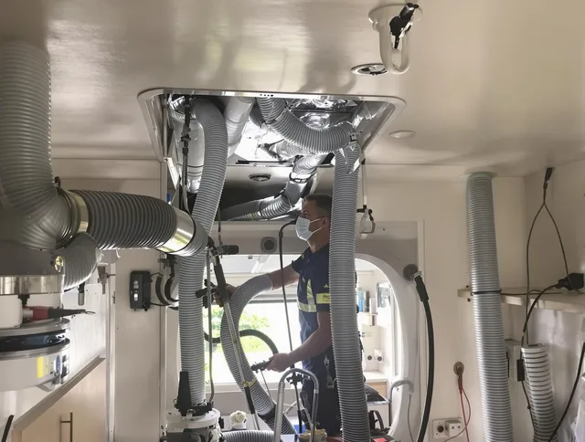 Millbury Air Duct Cleaning specialist performing precise mobile home duct cleaning in Millbury