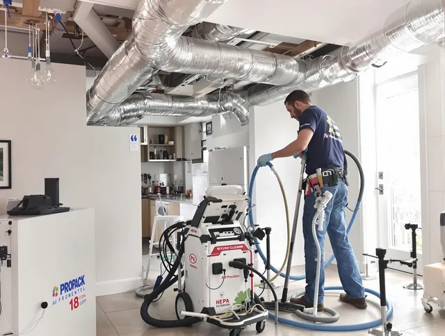 Millbury Air Duct Cleaning technician performing advanced pure duct cleaning with specialized equipment in Millbury