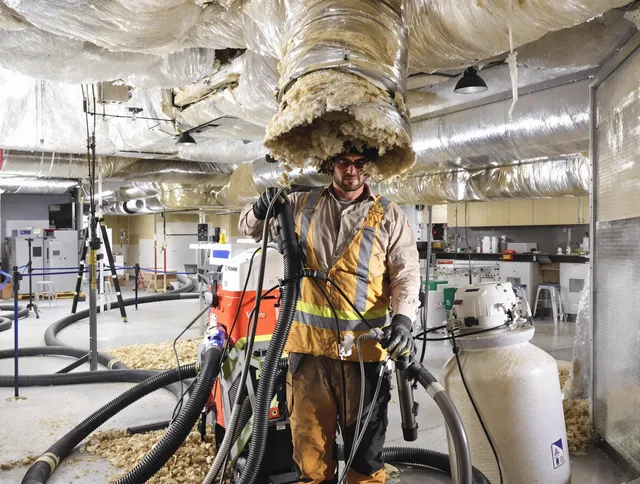 Professional vacuum insulation removal by Millbury Air Duct Cleaning expert in Millbury